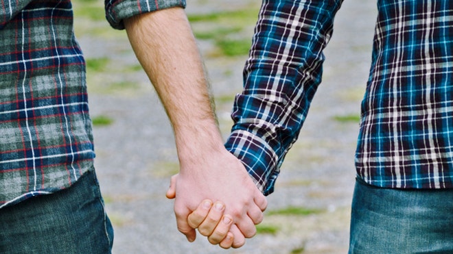 Gay couple holding hands istock.jpg